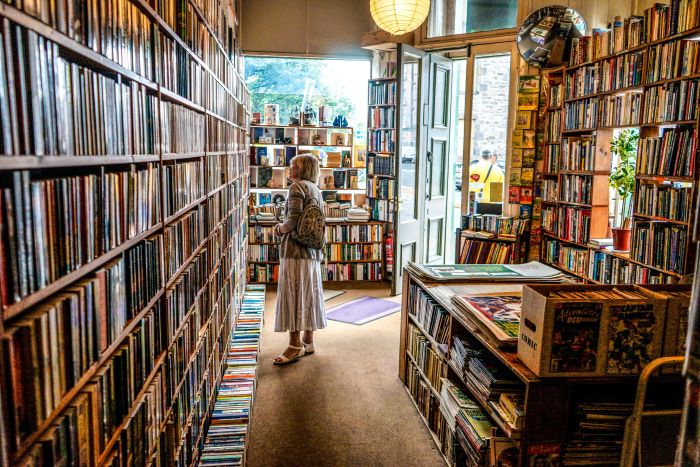 A woman browsing a bookstore