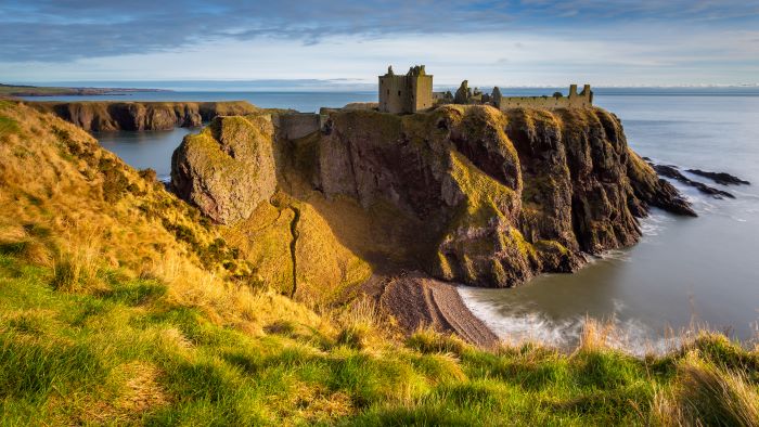 A view of Dunnottar Castle in Stonehaven on a windy day.