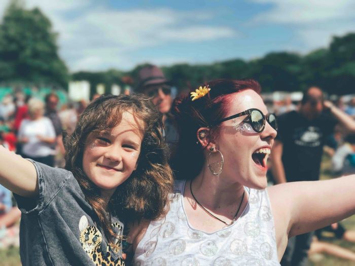 A parent and child at a festival