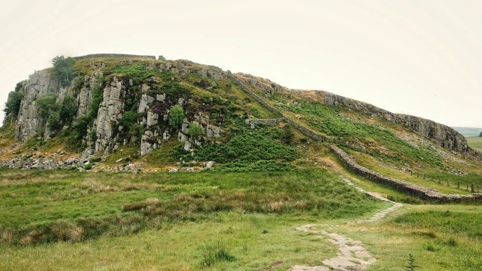 A hill with Hadrian's Wall running down it.