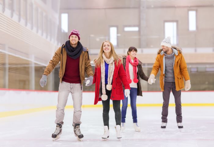 Two couples ice skating