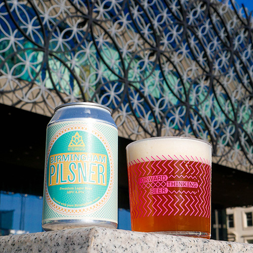 Birmingham Pilsner pint next to Birmingham Library