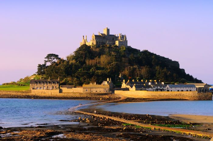 Full view of St Michael’s Mount against an evening sky.