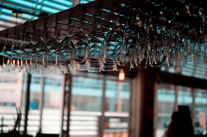 Wine glass storage at a bar.