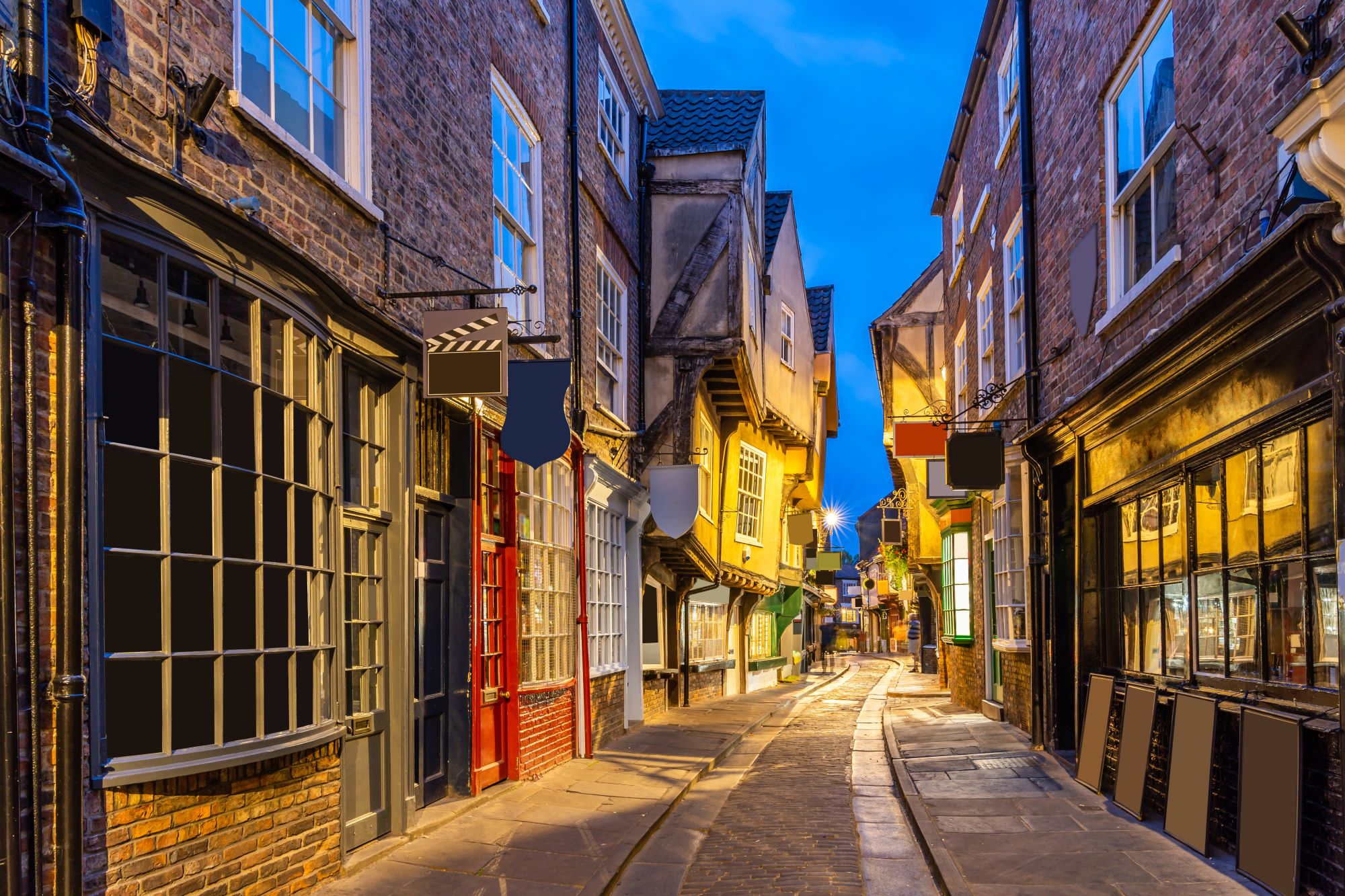 The winding streets of the Shambles in York with historic buildings and shopfronts.